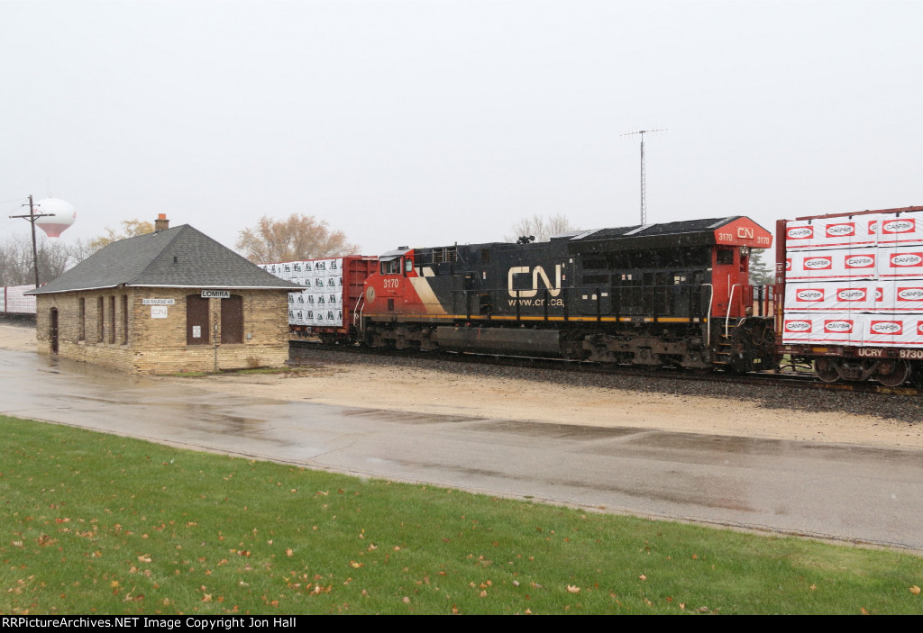 Running as a midtrain DPU, 3170 rolls past the depot as X342 continues past